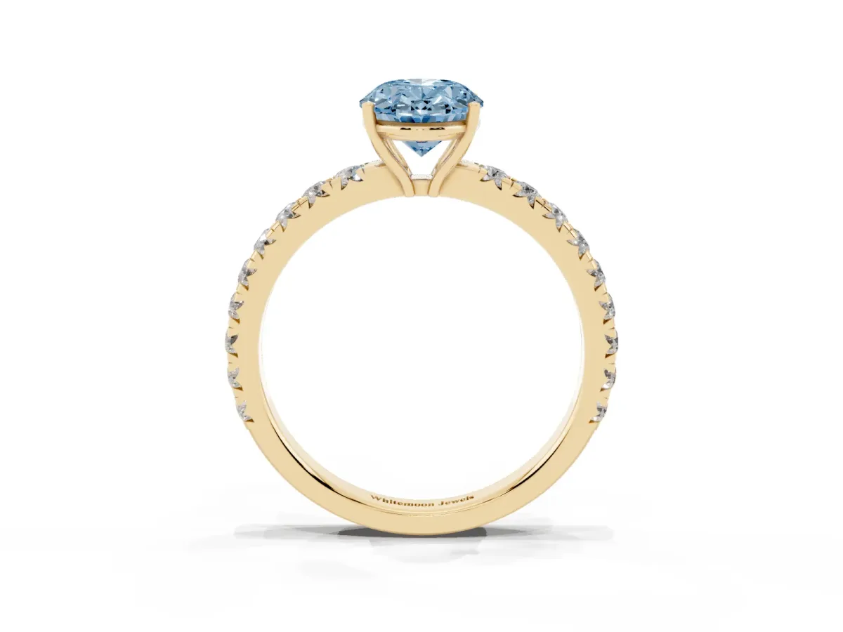 Fancy Blue Oval Cut Diamond Pavé Solitaire Engagement Ring with Four-Prong Setting Yellow gold