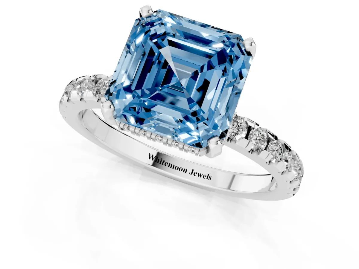 Fancy Blue Asscher Cut Diamond Solitaire Ring with Round Pavé Band and Four-Prong Setting Silver