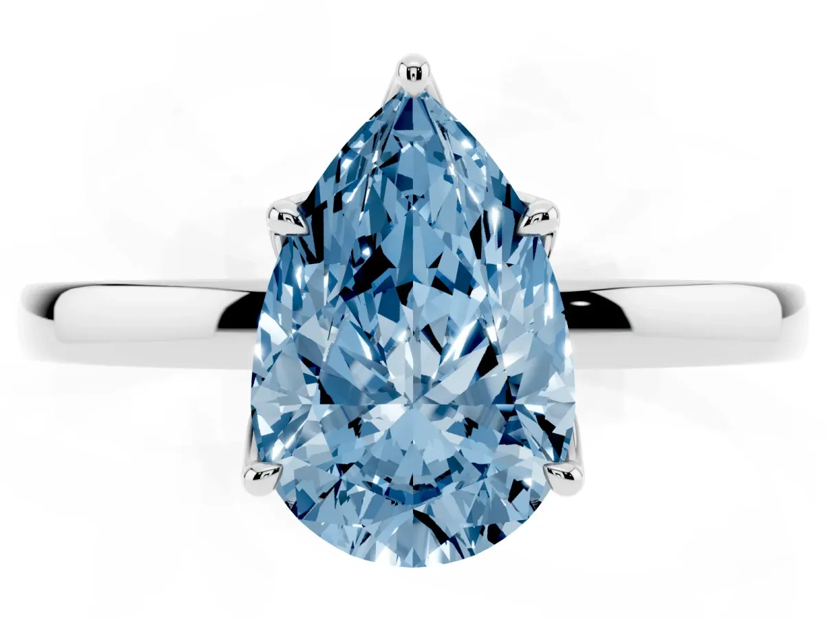 Fancy Blue Pear Cut Diamond Solitaire Ring with Thin Band and Prong Setting Silver