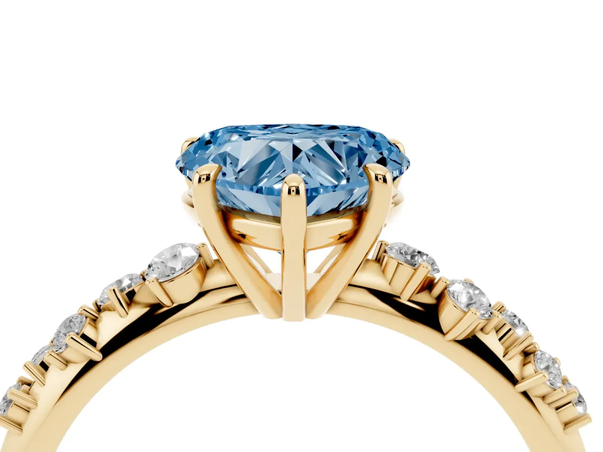 Fancy Blue Heart Cut Diamond Cluster Side Stone Solitaire Ring with Prong Setting Yellow gold