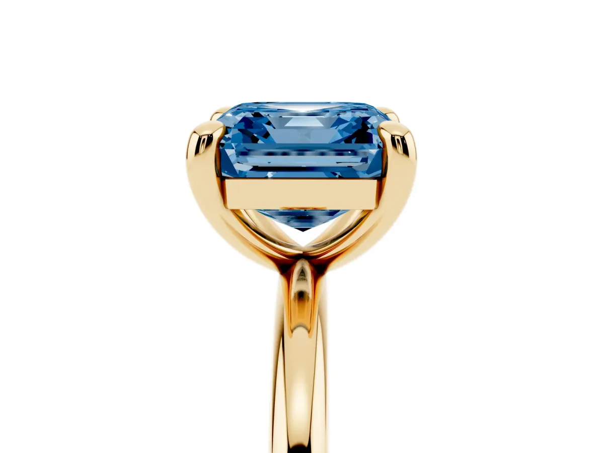 Fancy Blue Asscher Cut Solitaire Diamond Ring with Four-Prong Setting on a Plain Band Yellow gold