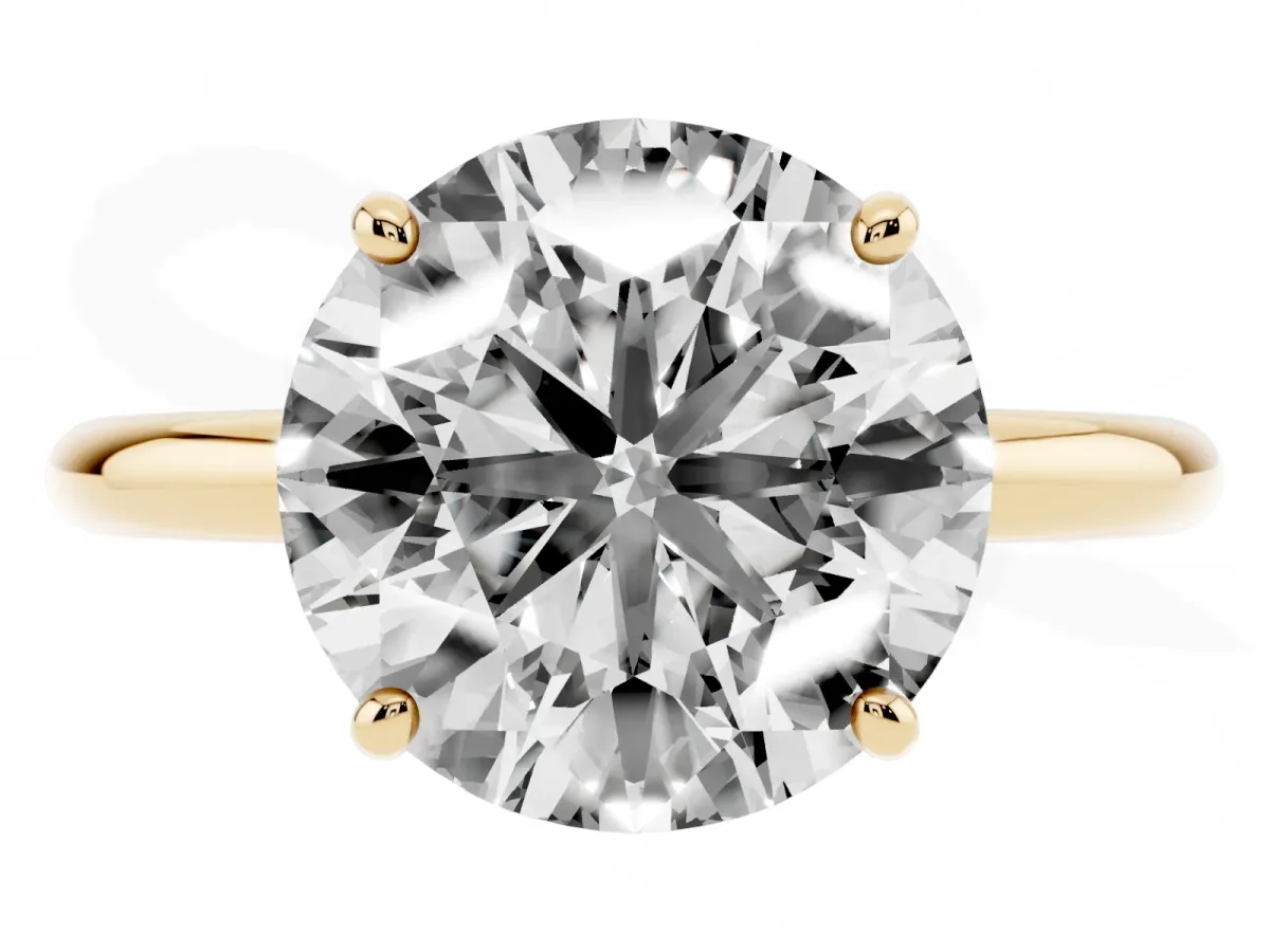 Round Cut Solitaire Diamond Ring with Four-Prong Setting on a Plain Band Yellow gold