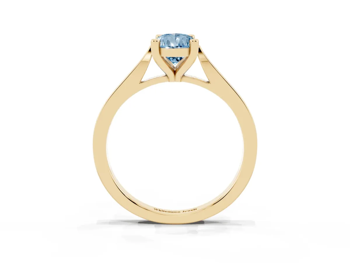 Fancy Blue Pear Cut Solitaire Diamond Ring with Four-Prong Setting and Tapered Band Yellow gold