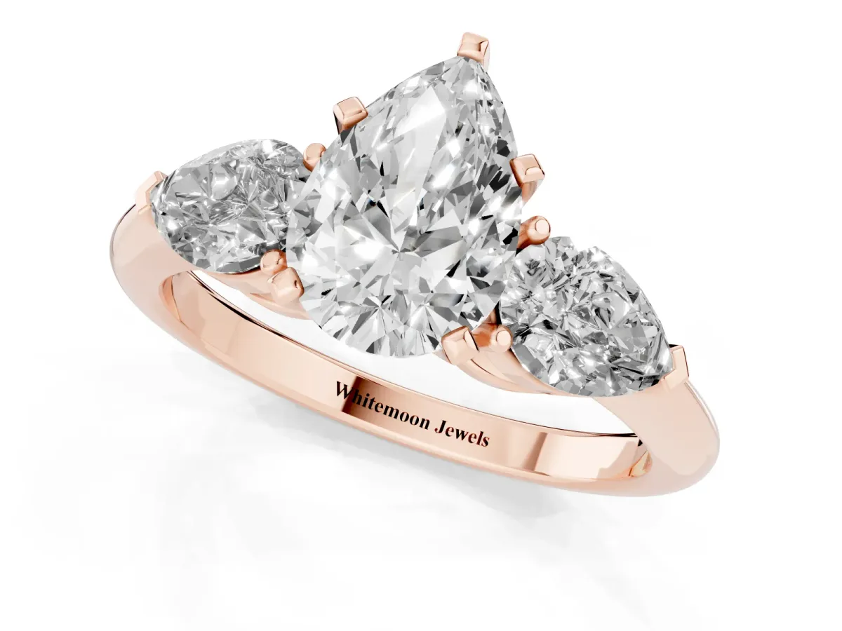 Three-Stone Pear Cut Diamond Ring with Pear Side Stones and Four-Prong Setting Rose gold
