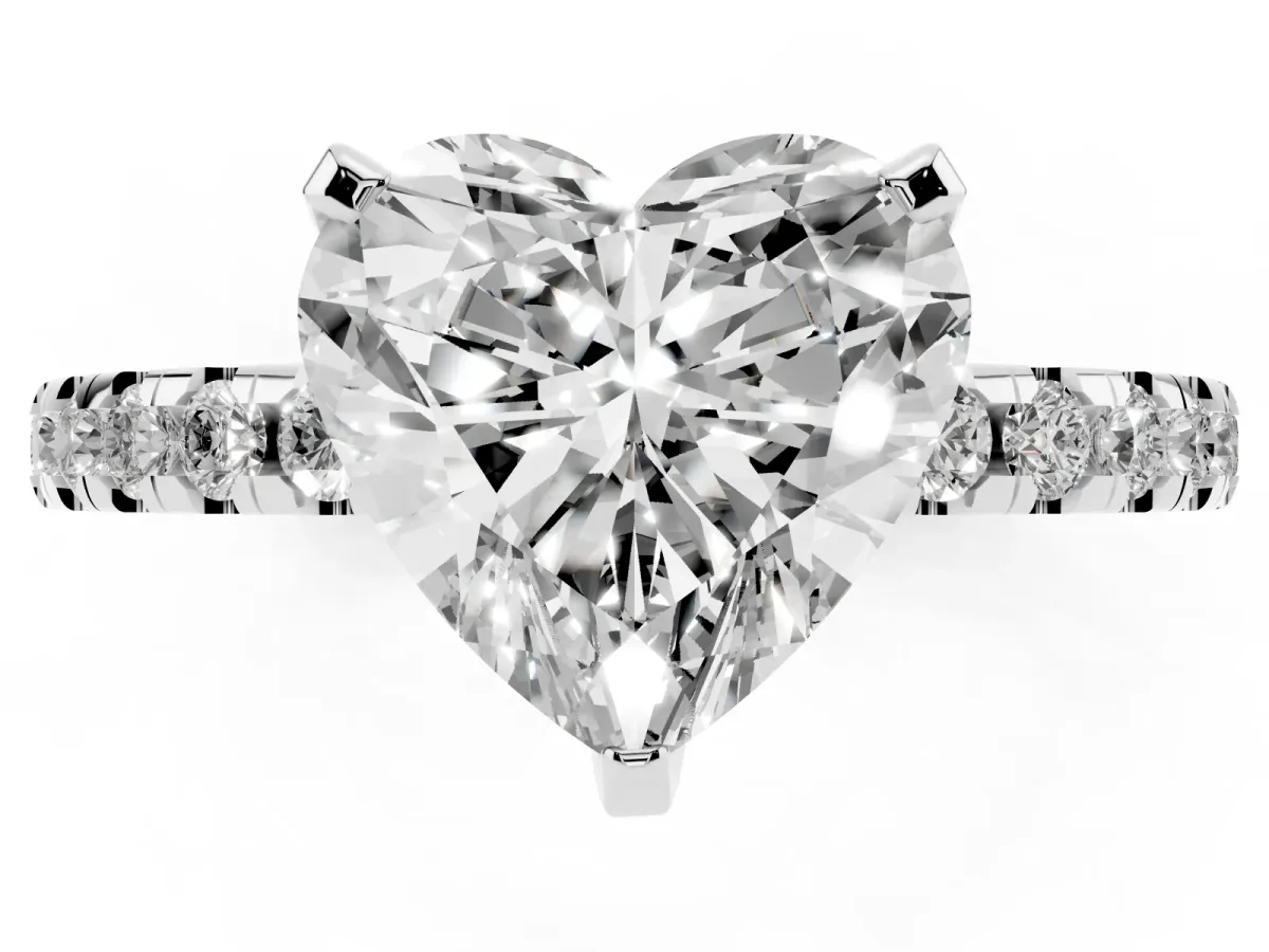 Heart Cut Diamond Solitaire Ring with Round Pavé Band and Four-Prong Setting Silver