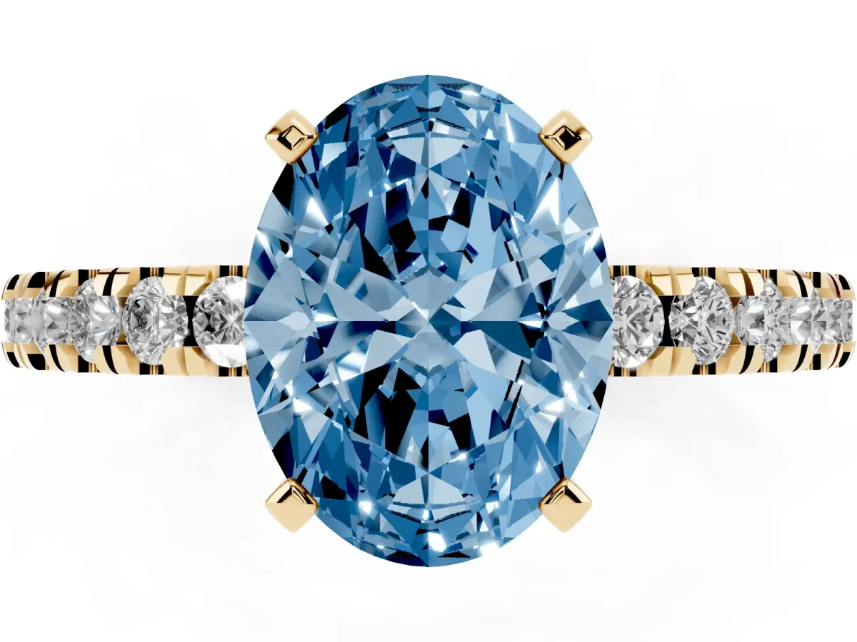 Fancy Blue Oval Cut Solitaire Diamond with Pavé Band and Four-Prong Setting Yellow gold