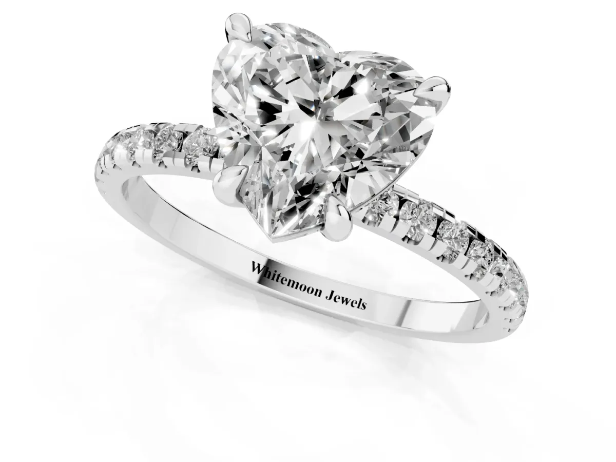 Heart Cut Diamond Brilliant Solitaire Ring with Pavé Band and Four-Prong Setting Silver