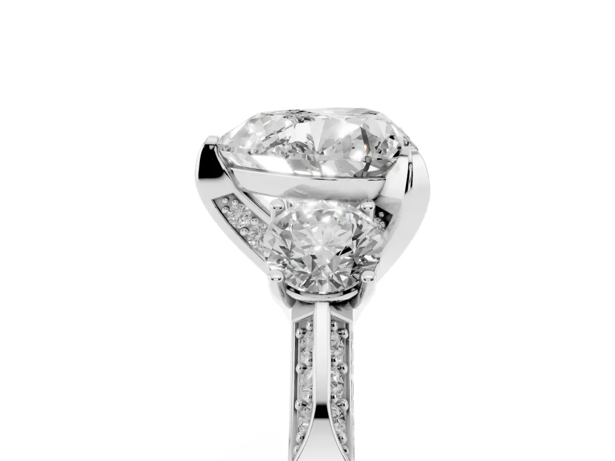 Heart Cut Brilliant Three-Stone Diamond Ring with Pavé Band and Four-Prong Setting Platinum