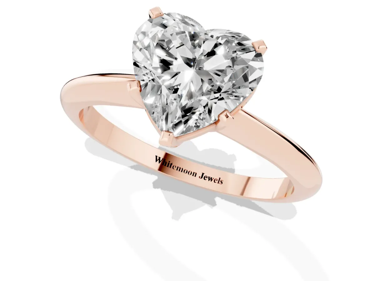 Heart Cut Cut Solitaire Ring with Four-Prong Setting on a Classic Band Rose gold