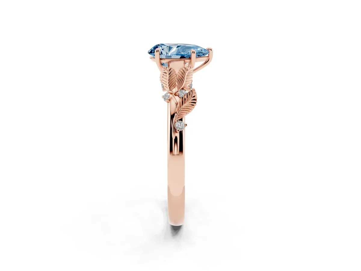 Fancy Blue Pear Cut Diamond Solitaire Ring with Leaf Motif Band and Four-Prong Setting Rose gold