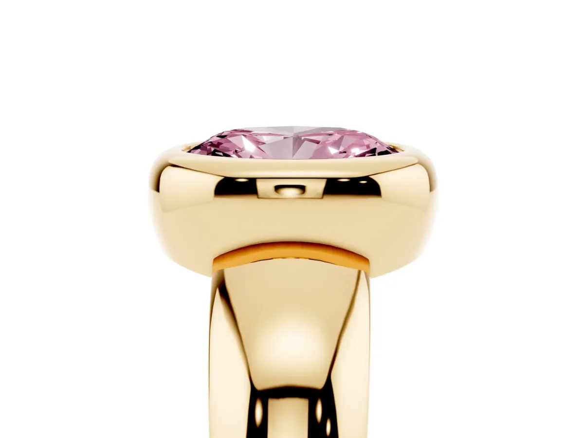 Fancy Pink Bezel Set Oval Cut Solitaire Ring with Wide Band Yellow gold