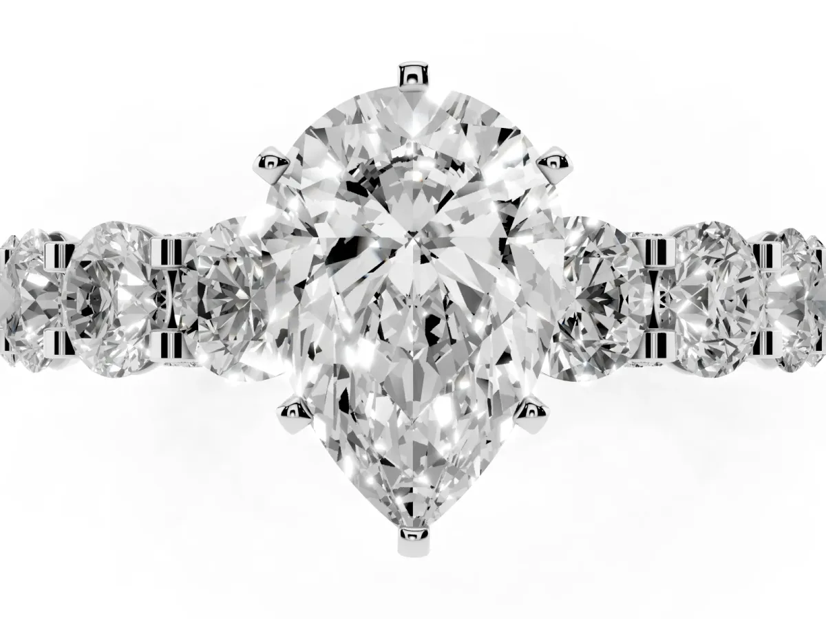 Pear Cut Diamond Side Stone Engagement Ring with Four-Prong Setting Silver