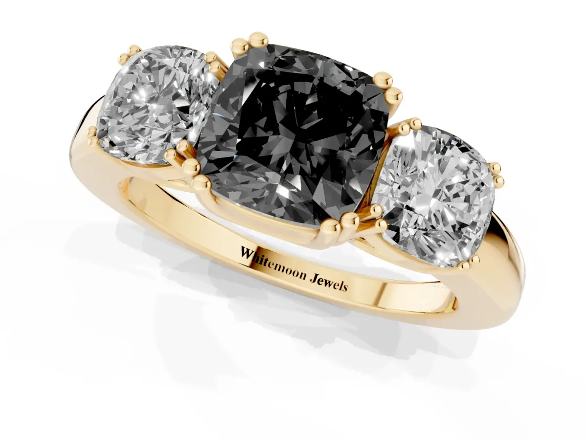 Fancy Black Three-Stone Cushion Cut Cut Diamond Ring with Channel Set Band and Four-Prong Setting Yellow gold