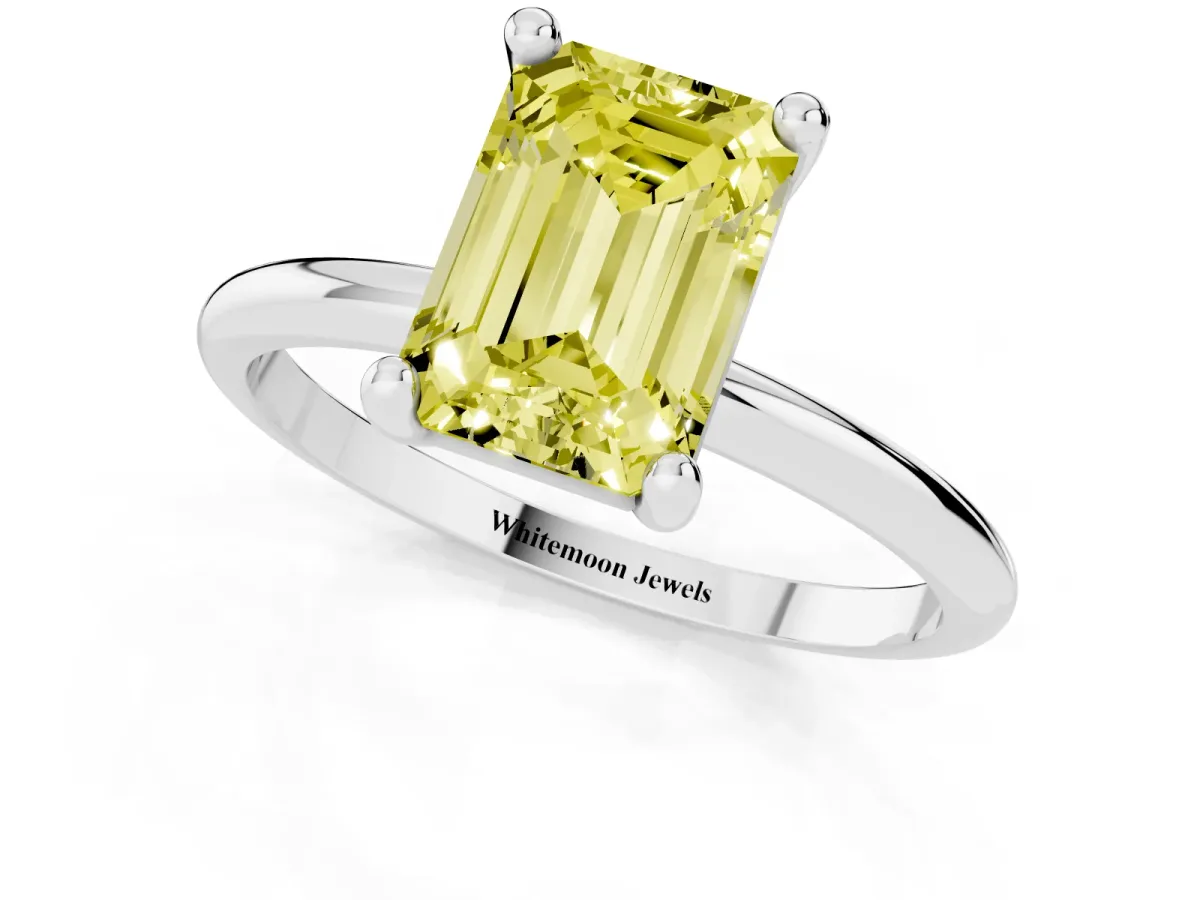 Fancy Yellow Emerald Cut Solitaire Diamond Ring with 4-Prong Setting on a Classic Band White gold