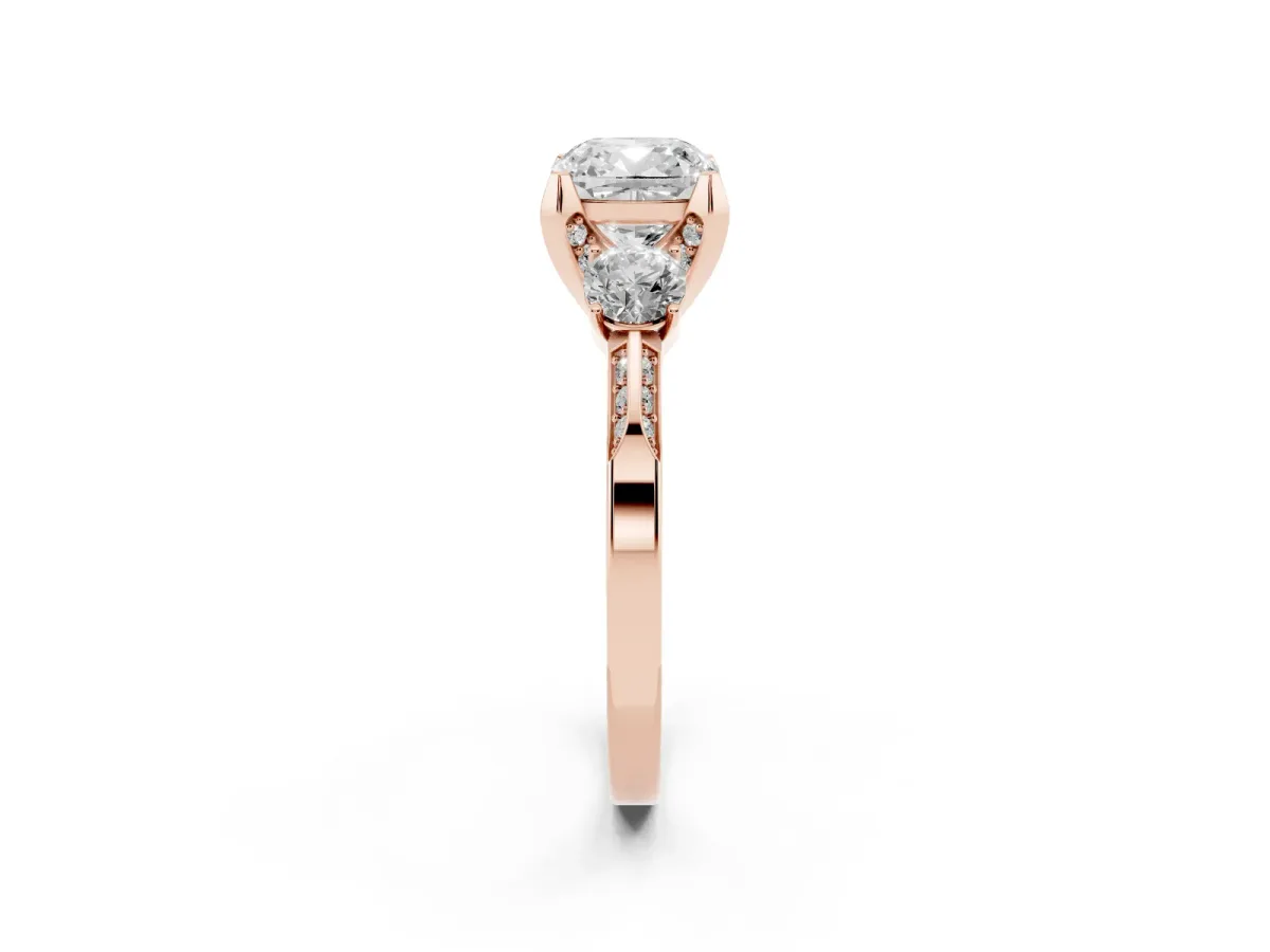 Cushion Cut Brilliant Three-Stone Diamond Ring with Pavé Band and Four-Prong Setting Rose gold