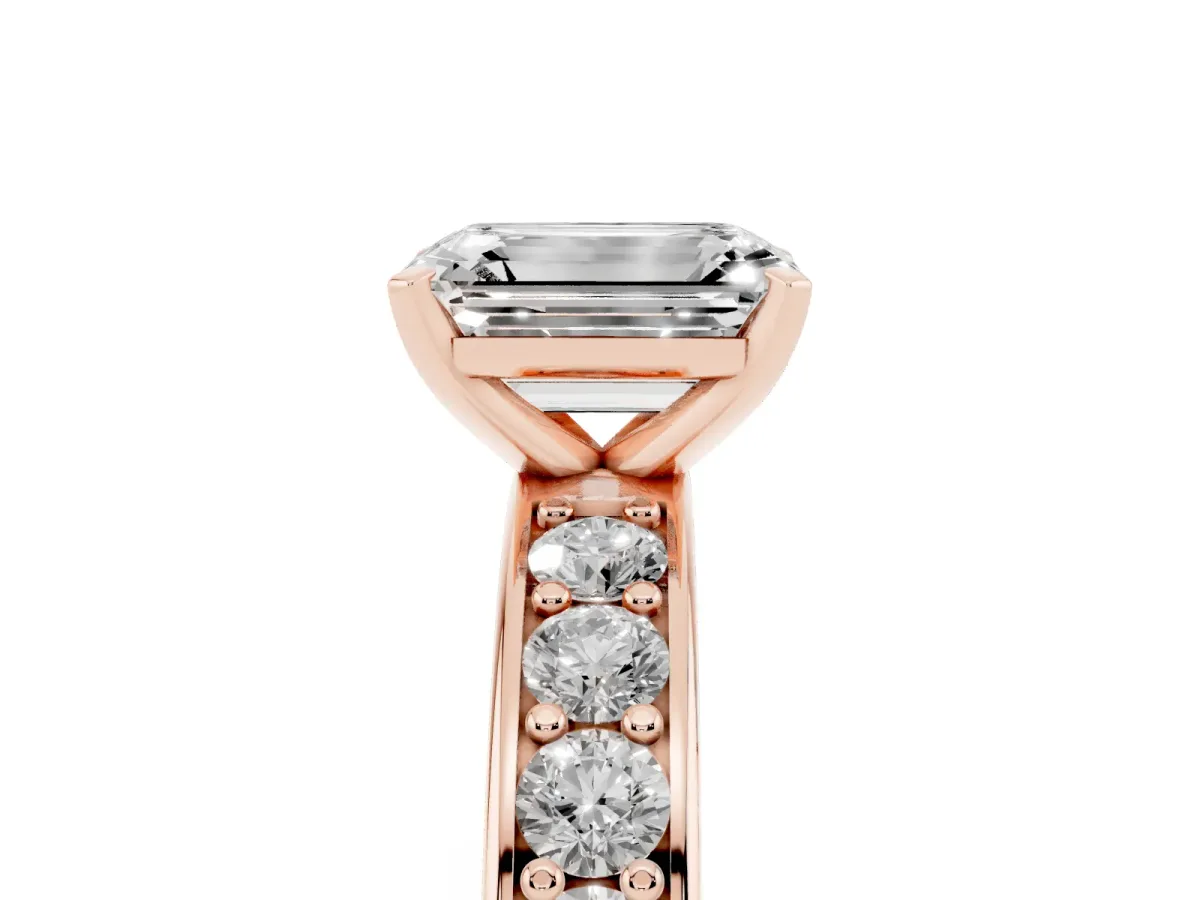 Emerald Cut Diamond Engagement Ring with Channel Set Round Band and Prong Setting Rose gold