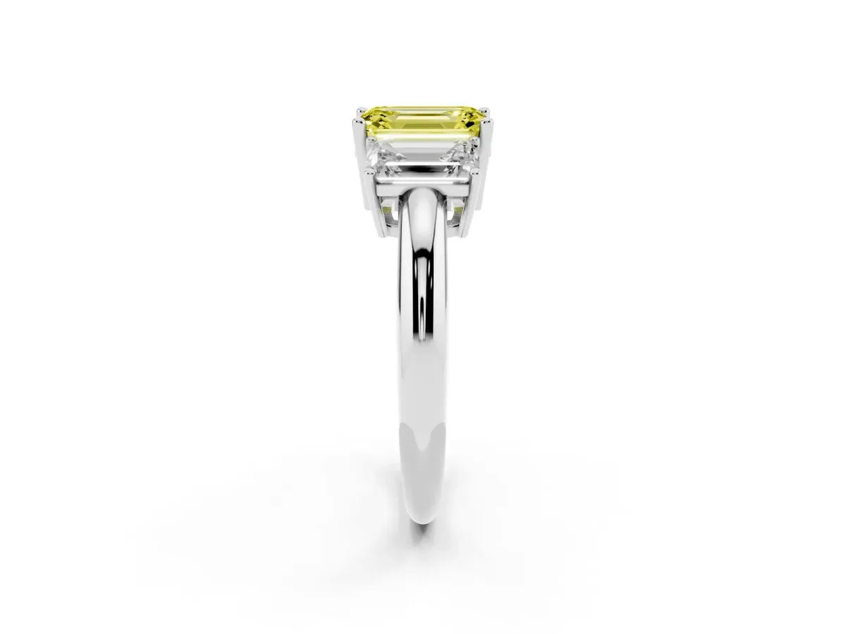 Fancy Yellow Three-Stone Emerald Cut Cut Diamond Engagement Ring with Prong Setting on a White Gold Band Platinum