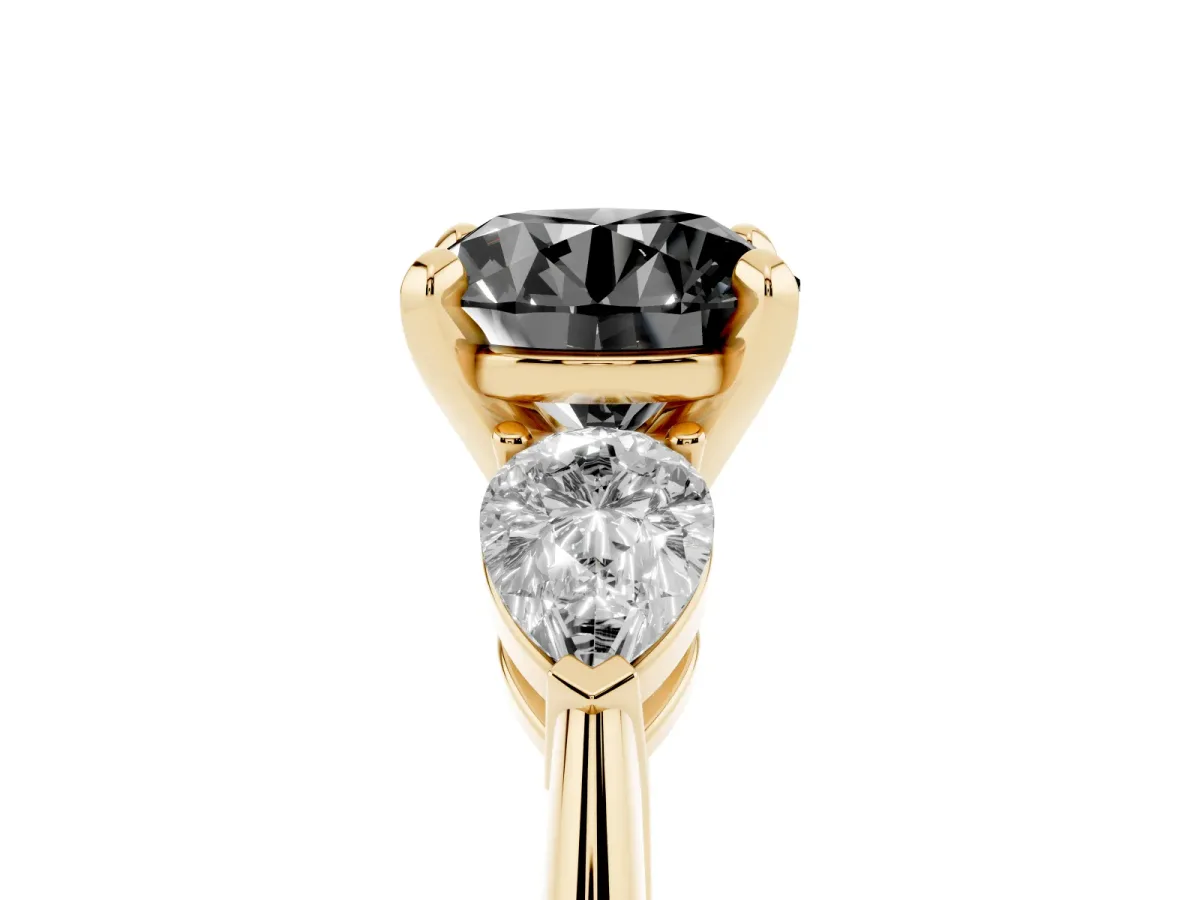 Fancy Black Three-Stone Round Cut Diamond Ring with Pear Side Stones and Four-Prong Setting Yellow gold