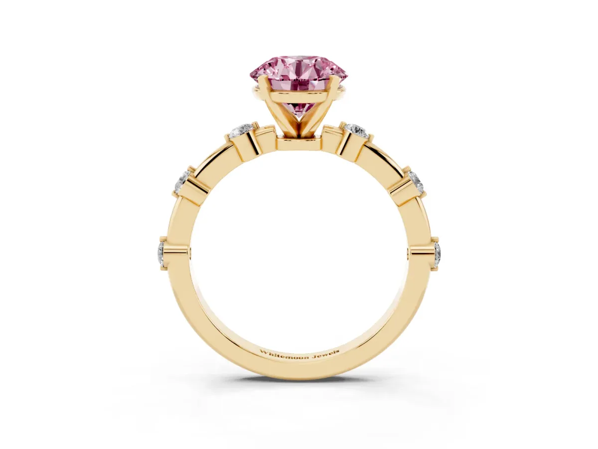 Fancy Pink Round Cut Solitaire Diamond Ring with Bezel Set Side Stones and Prong Setting Yellow gold