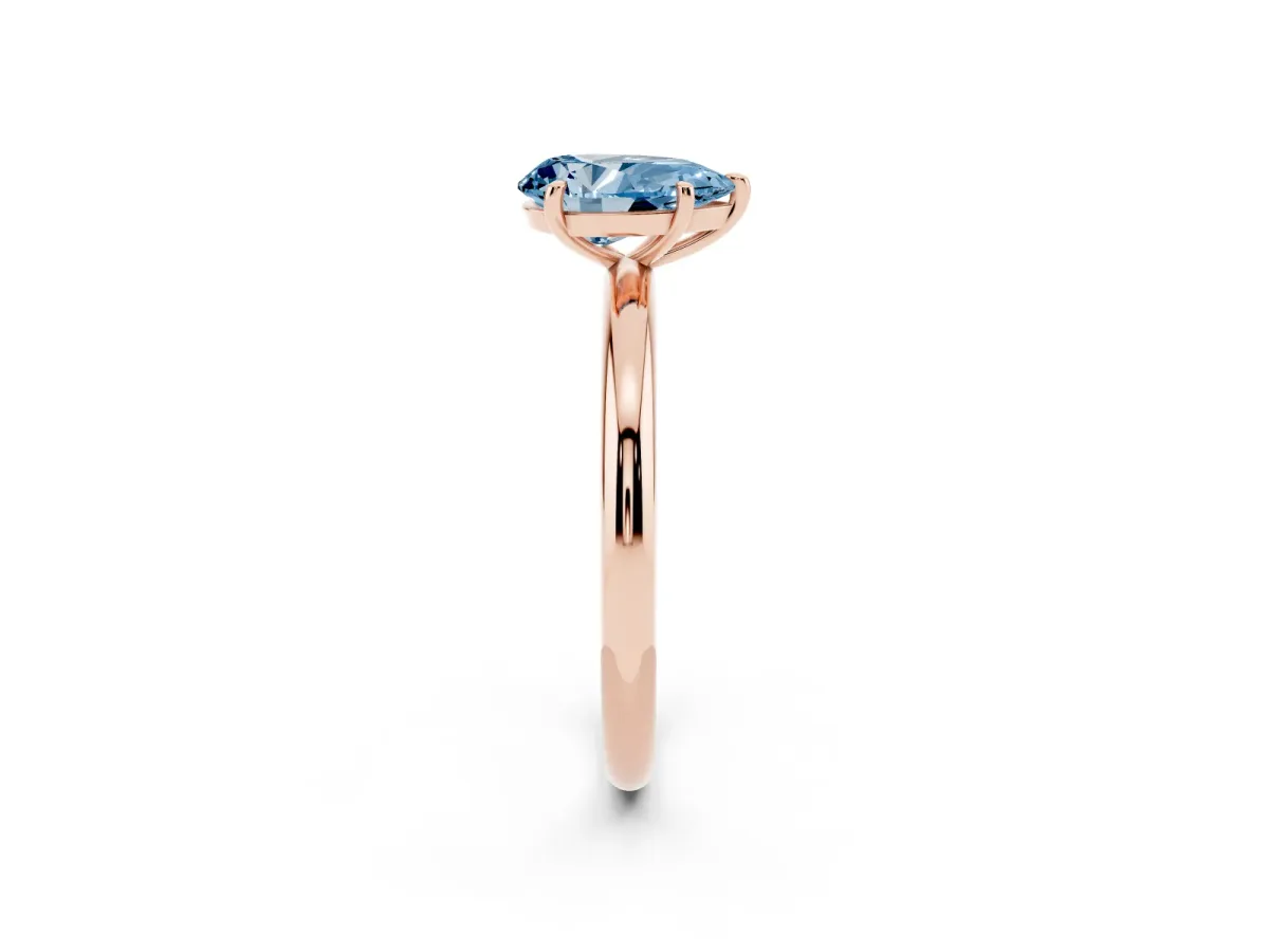 Fancy Blue Pear Cut Solitaire Diamond Ring with Four-Prong Setting on a Plain Band Rose gold