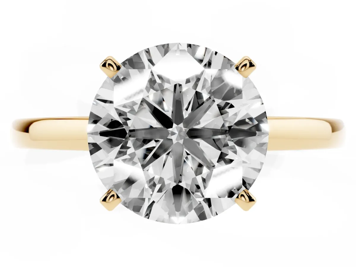 Round Cut Solitaire Diamond Engagement Ring with Four-Prong Setting on a Classic Band Yellow gold