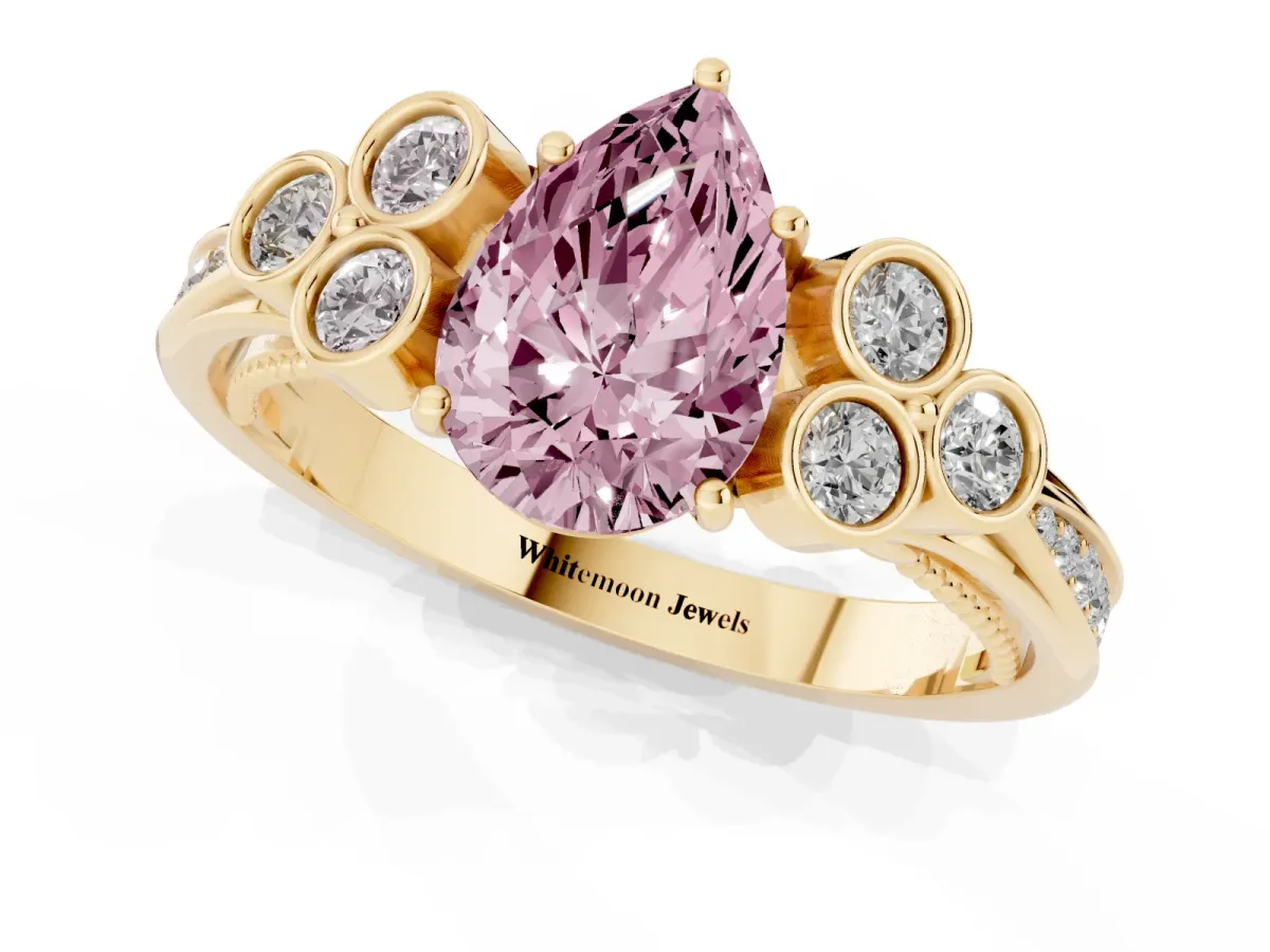 Fancy Pink Pear Cut Cut Diamond Engagement Ring with Bezel Set Round Side Stones and Prong Setting Yellow gold