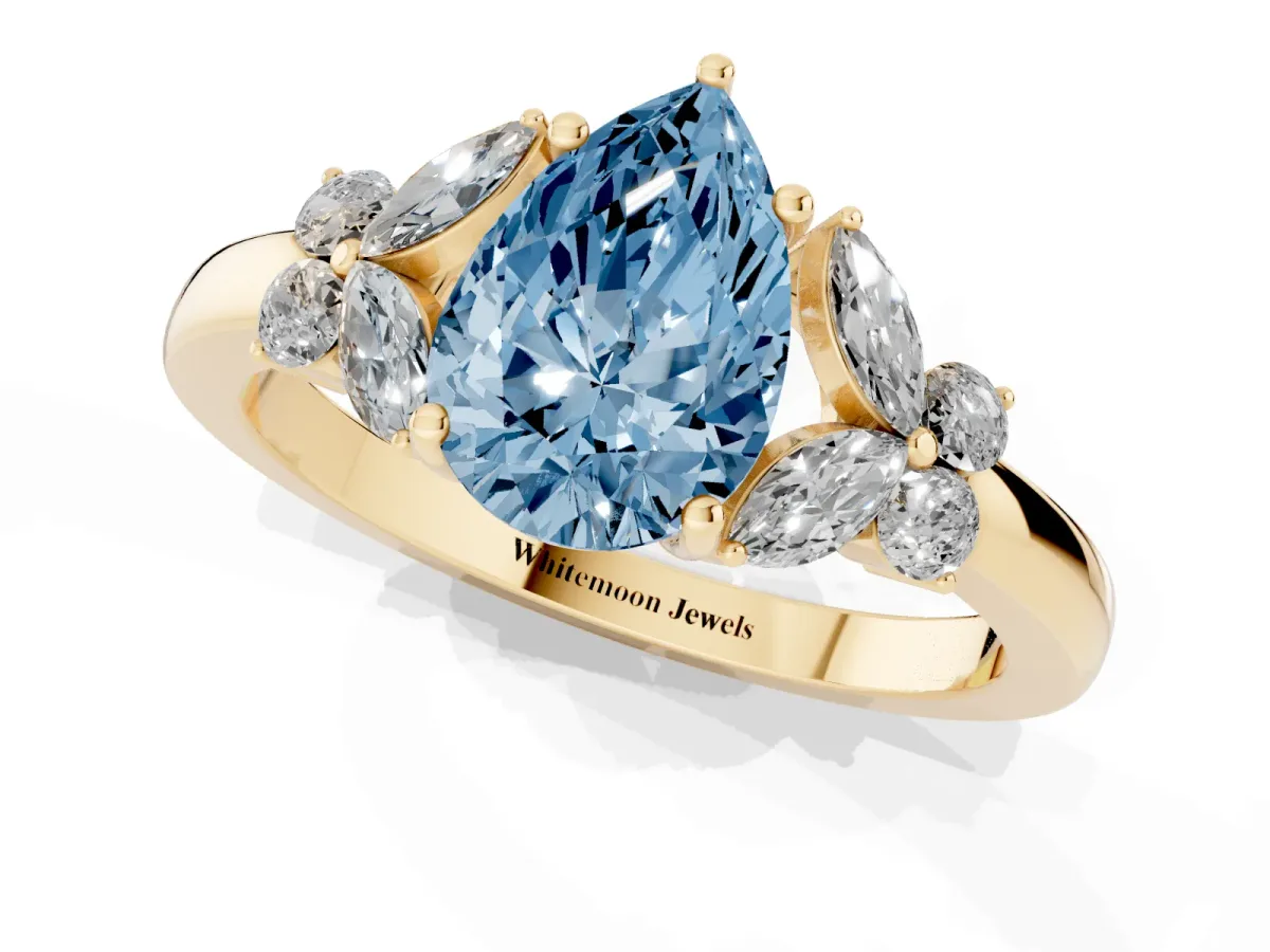 Fancy Blue Pear Cut Cut Solitaire Floral Diamond Ring with Four-Prong Setting Yellow gold