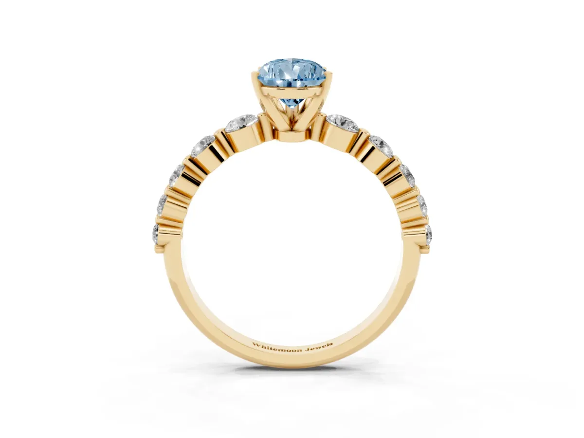 Fancy Blue Pear Cut Solitaire Diamond Ring with Pave Band and Four-Prong Setting Yellow gold