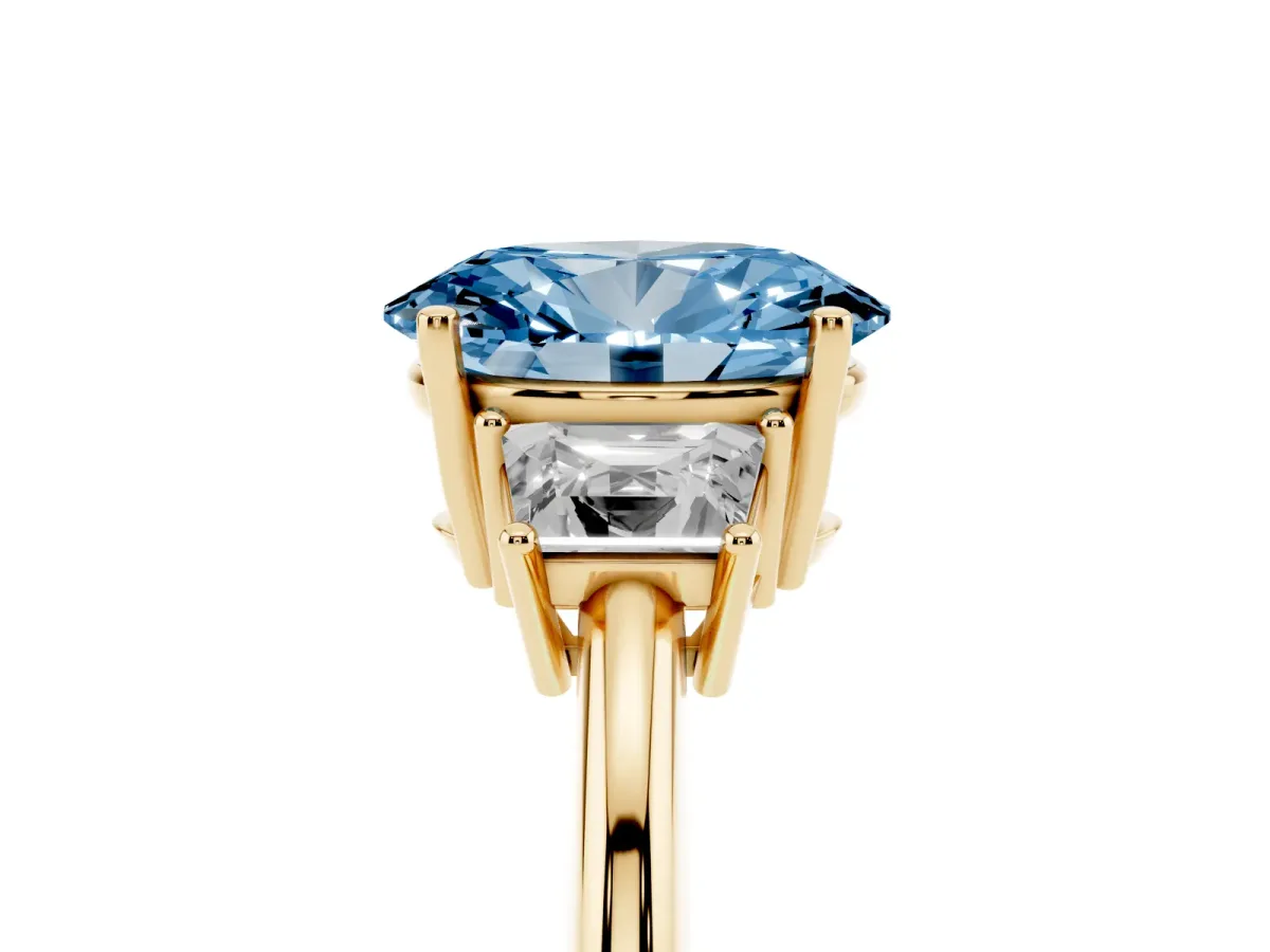 Fancy Blue Oval Cut Diamond Three-Stone Ring with Trapezoid Side Stones and Prong Setting Yellow gold