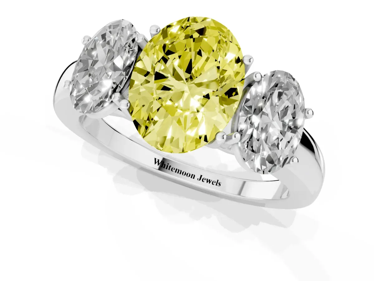 Fancy Yellow Oval Cut Diamond Three-Stone Ring with Four-Prong Setting and Classic Band Silver