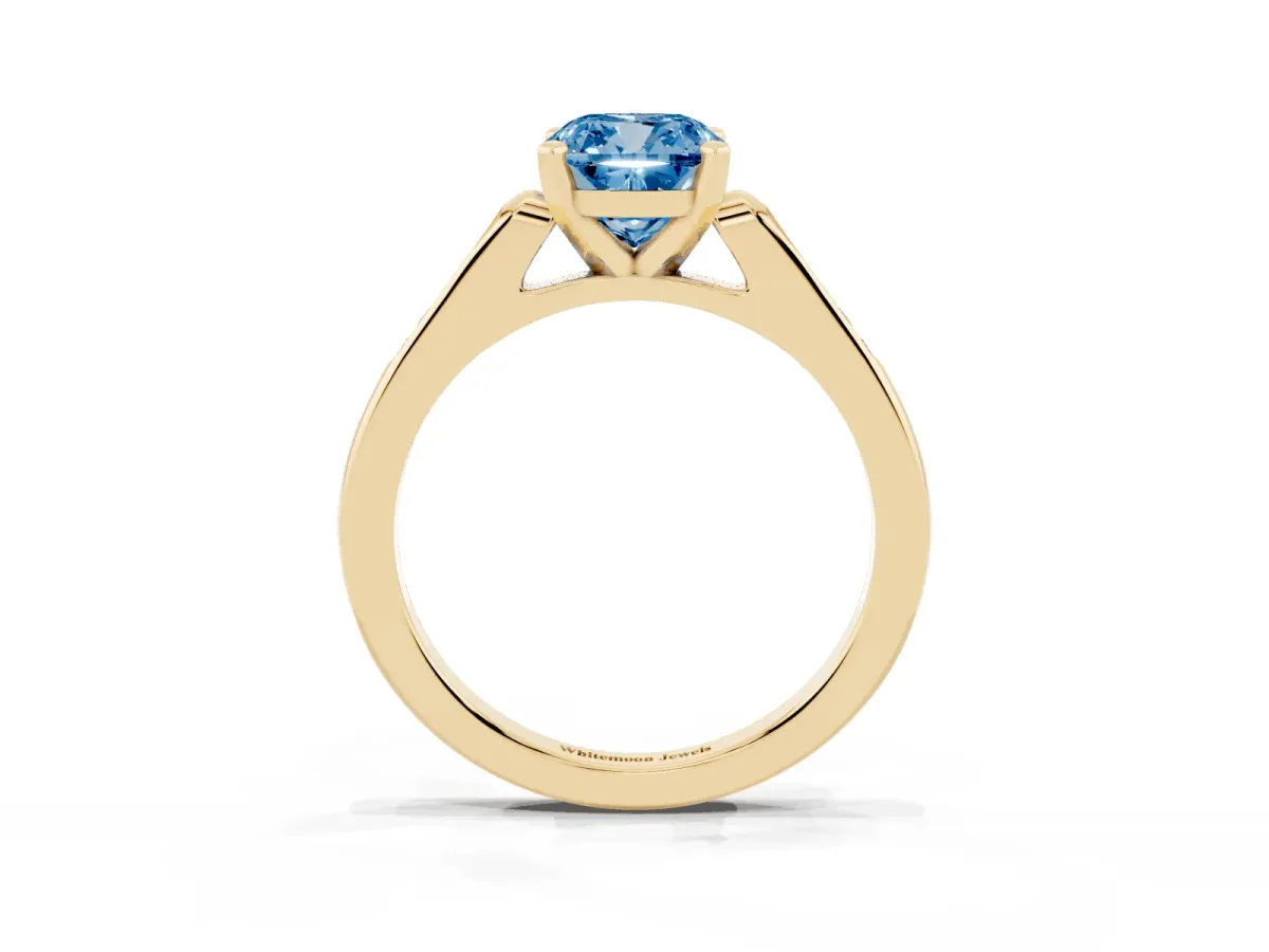 Fancy Blue Cushion Cut Diamond Solitaire Ring with Channel Set Round Band and Prong Setting Yellow gold