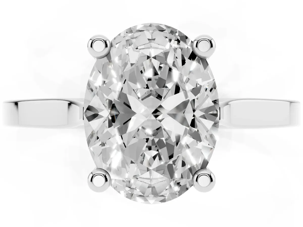 Oval Cut Solitaire Diamond Ring with Four-Prong Setting and Tapered Band Silver