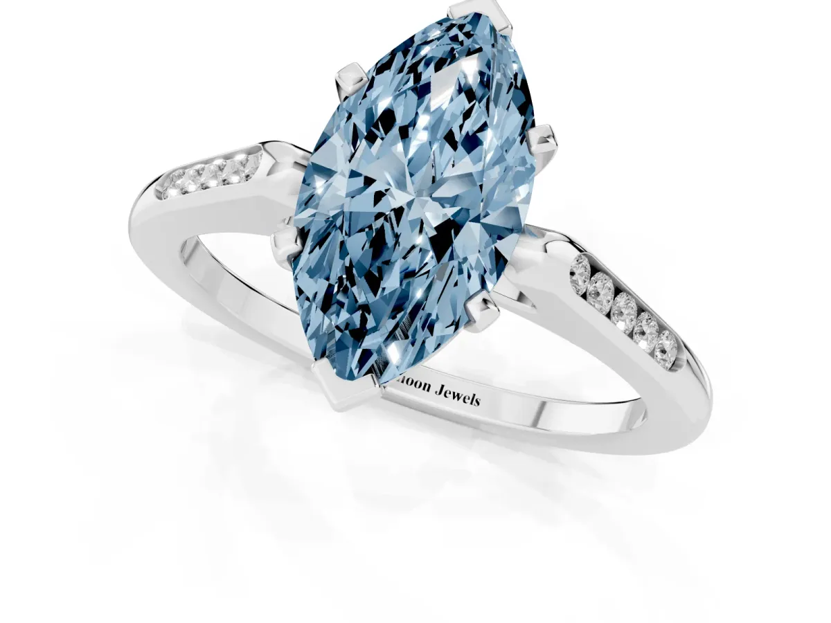 Fancy Blue Marquise Cut Diamond Solitaire Ring with Channel Set Round Band and Prong Setting Silver