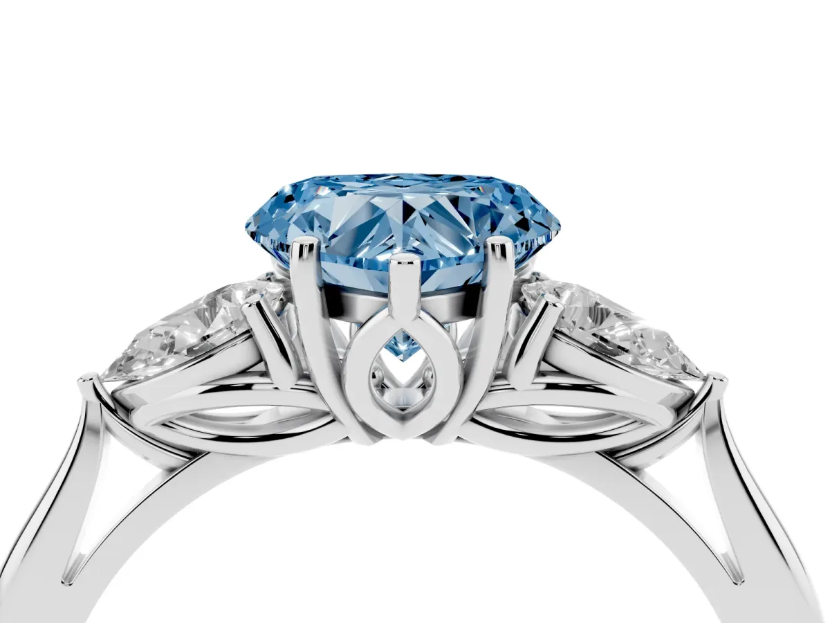 Fancy Blue Three-Stone Heart Cut Brilliant Diamond Solitaire Ring with Tapered Band and Four-Prong Setting White gold