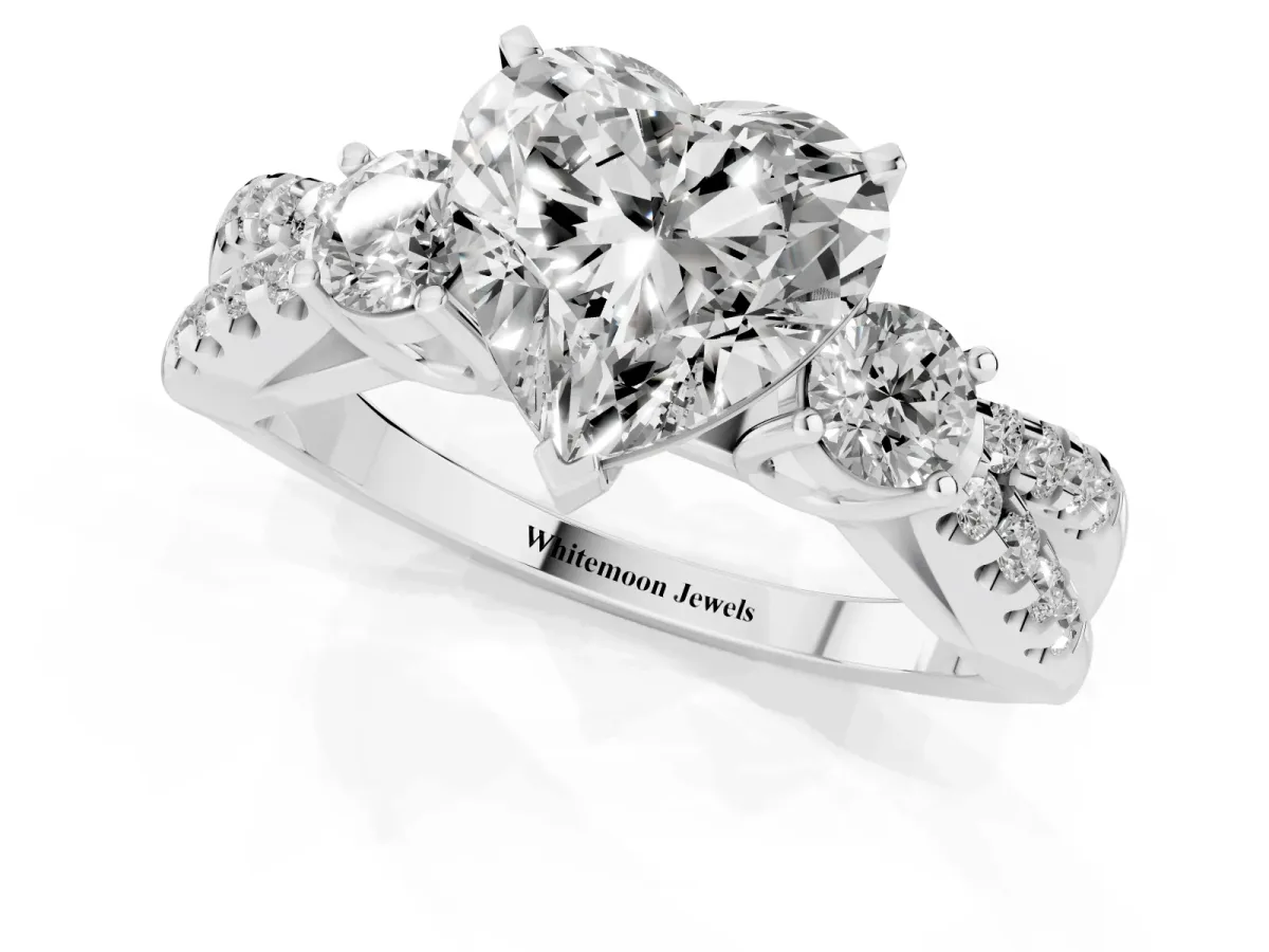 Heart Cut Diamond Three-Stone Ring with Pavé Split Shank and Four-Prong Setting White gold