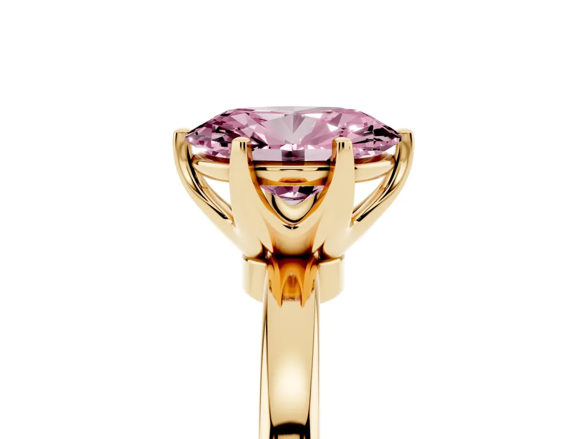 Fancy Pink Oval Cut Solitaire Diamond Ring with Six-Prong Setting on a Classic Band Yellow gold
