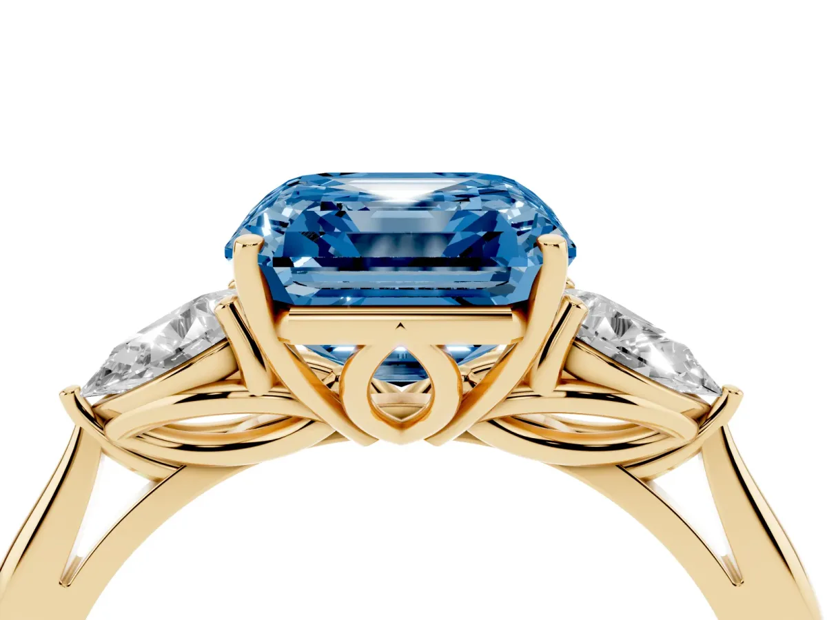Fancy Blue Asscher Cut Diamond Three-Stone Ring with Pear Side Stones and Prong Setting Yellow gold