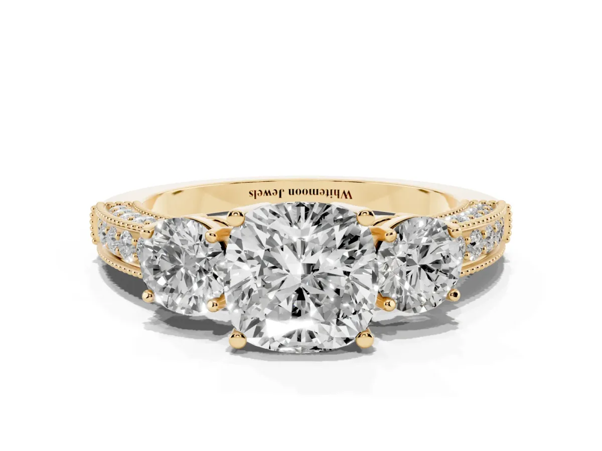 Cushion Cut Three-Stone Diamond Ring with Pavé Band and Four-Prong Setting Yellow gold