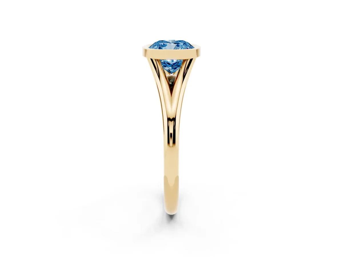 Fancy Blue Bezel Set Cushion Cut Cut Solitaire Ring with Tapered Band Yellow gold