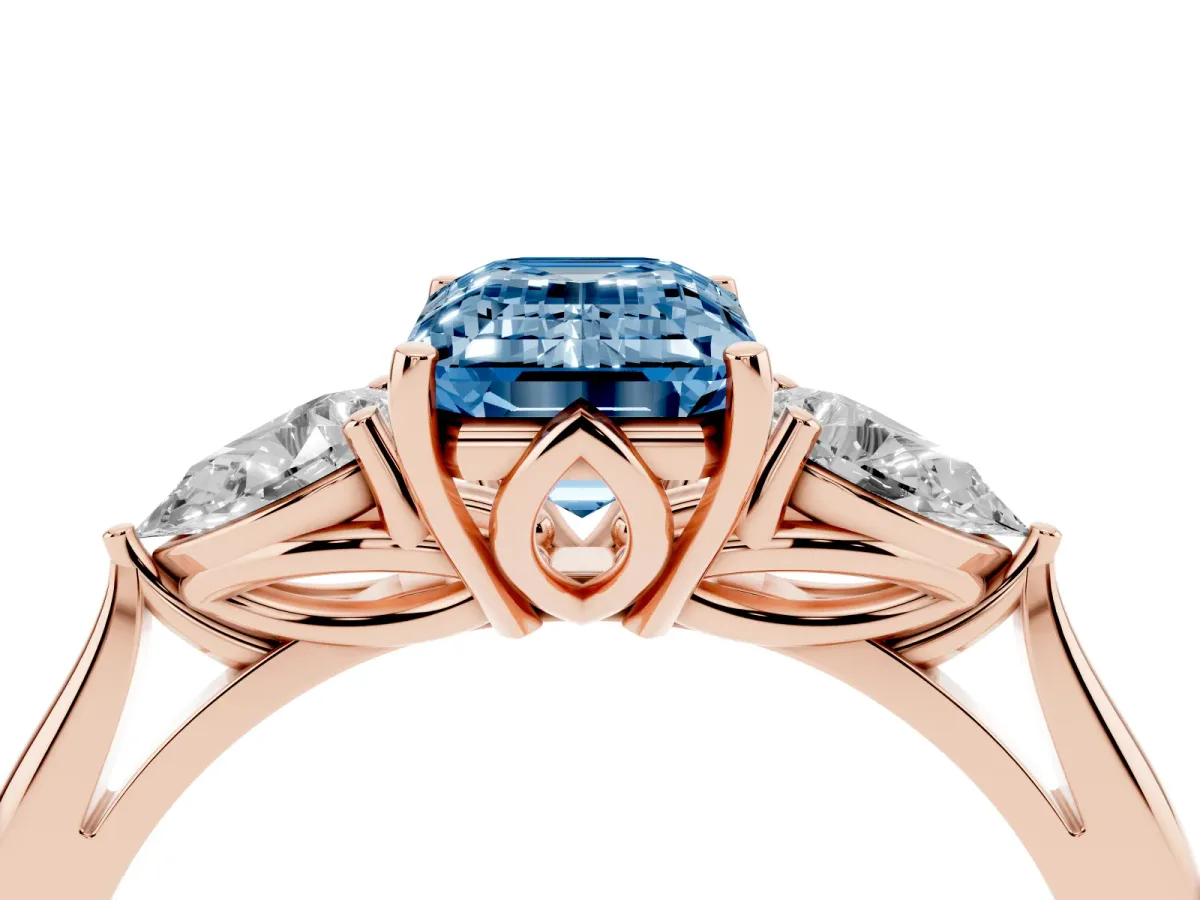 Fancy Blue Three-Stone Emerald Cut Brilliant Diamond Solitaire Ring with Tapered Band and Four-Prong Setting Rose gold