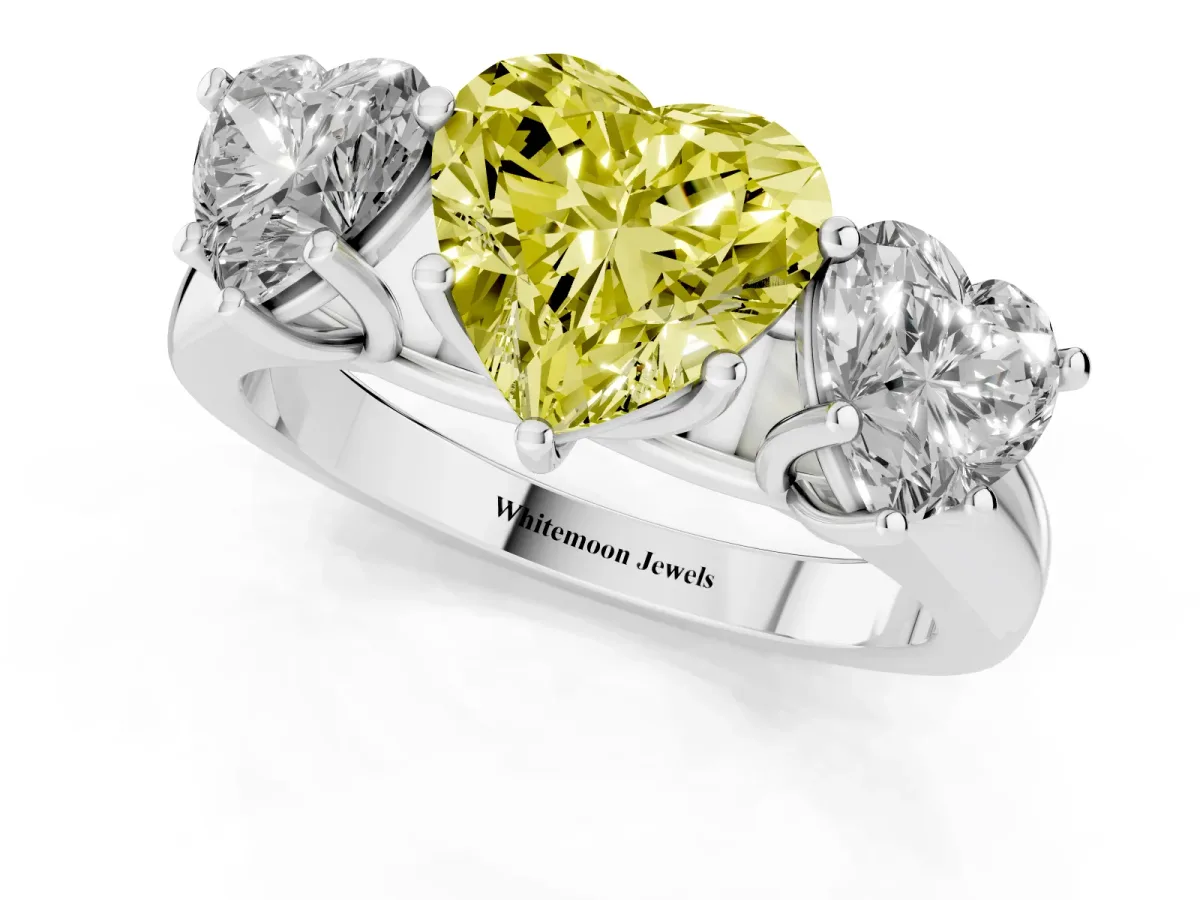 Fancy Yellow Heart Cut Three-Stone Diamond Ring with Prong Setting on a Classic Band Silver