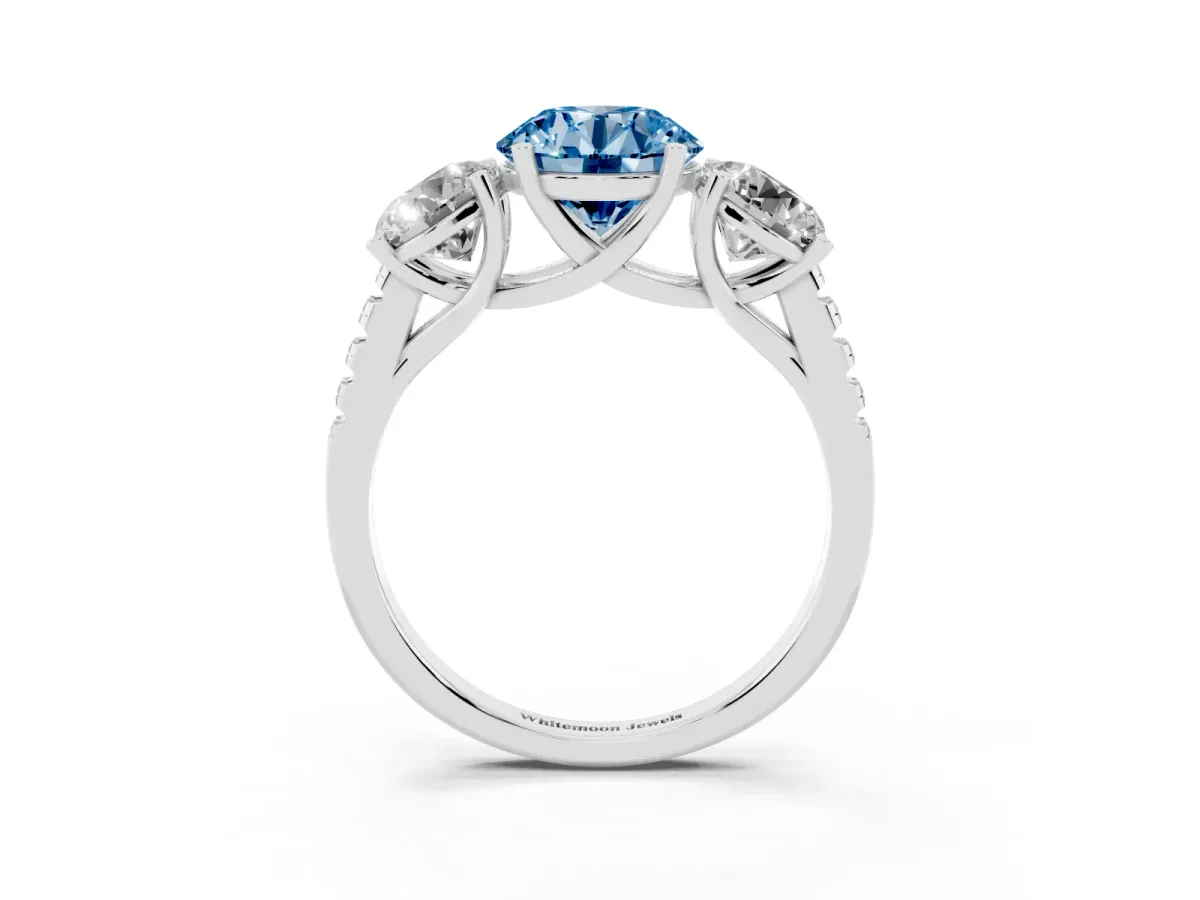 Fancy Blue Three-Stone Round Cut Diamond Ring with Round Pavé Band and Prong Setting Silver