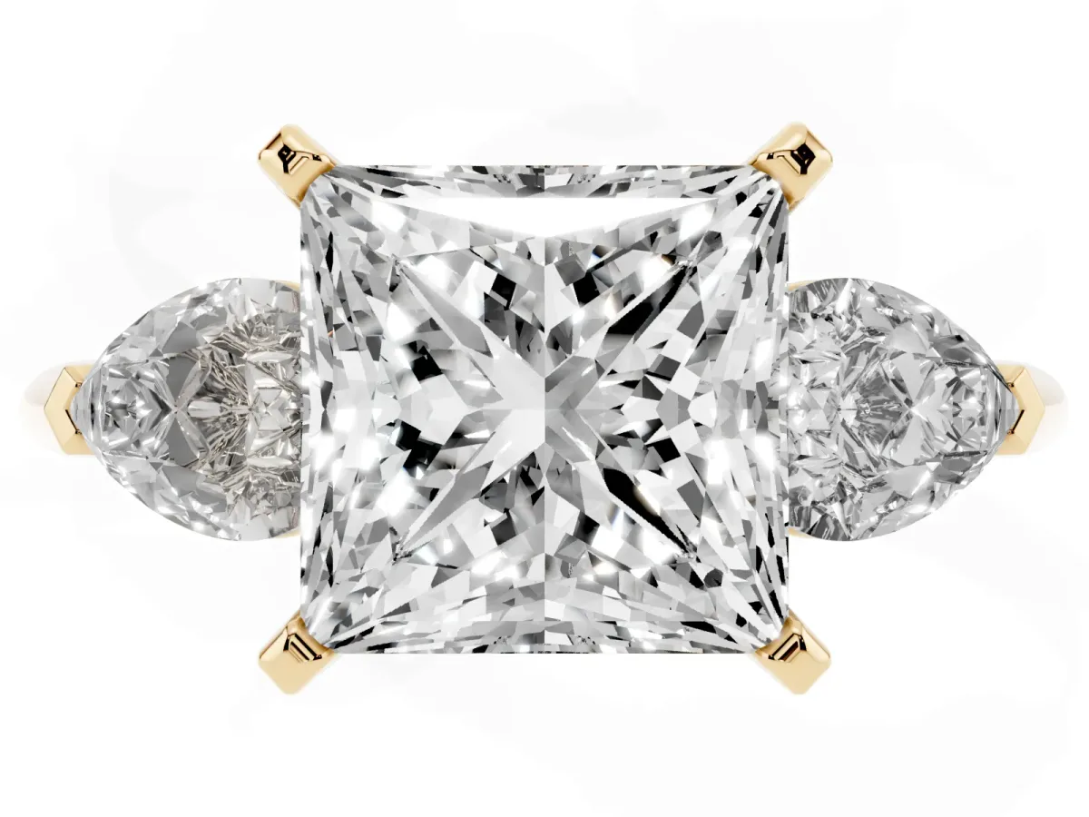 Three-Stone Princess Cut Diamond Ring with Pear Side Stones and Four-Prong Setting Yellow gold