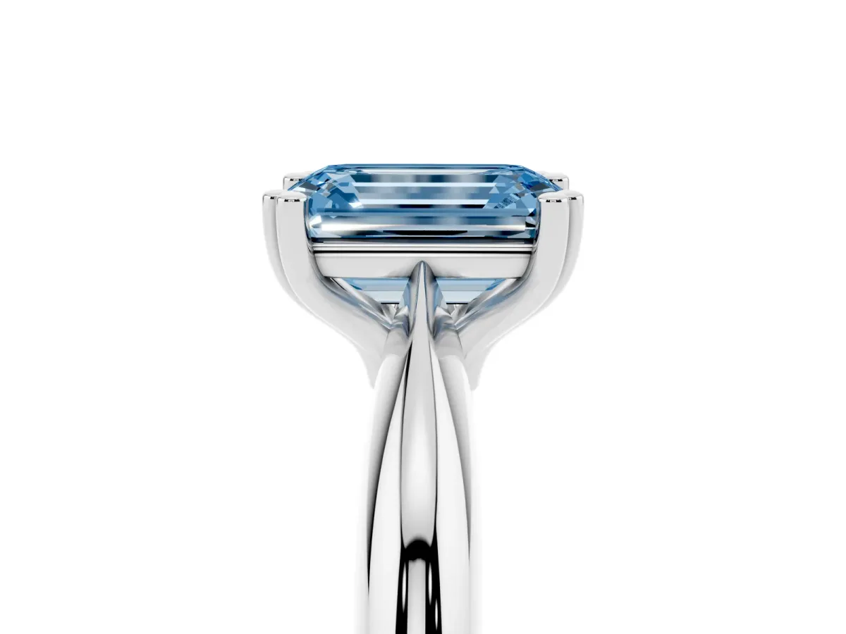 Fancy Blue Emerald Cut Cut Solitaire Engagement Ring with Tapered Band and Four-Prong Setting Silver