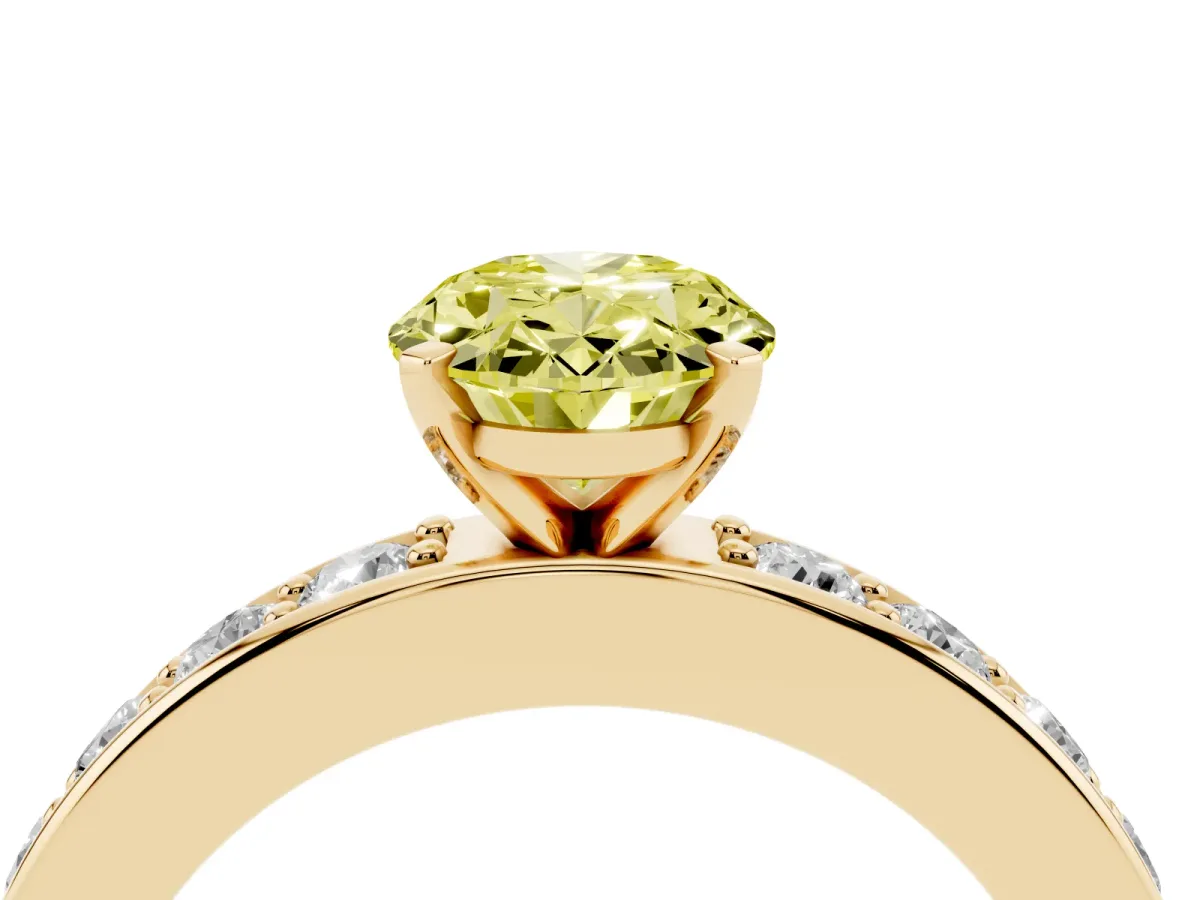 Fancy Yellow Oval Cut Diamond Engagement Ring with Channel Set Round Band and Prong Setting Yellow gold