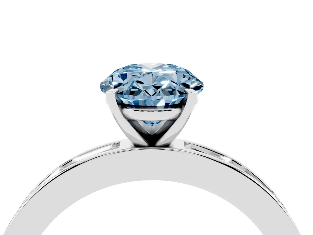 Fancy Blue Oval Cut Solitaire Diamond Ring with Channel-Set Baguette Band and Four-Prong Setting White gold