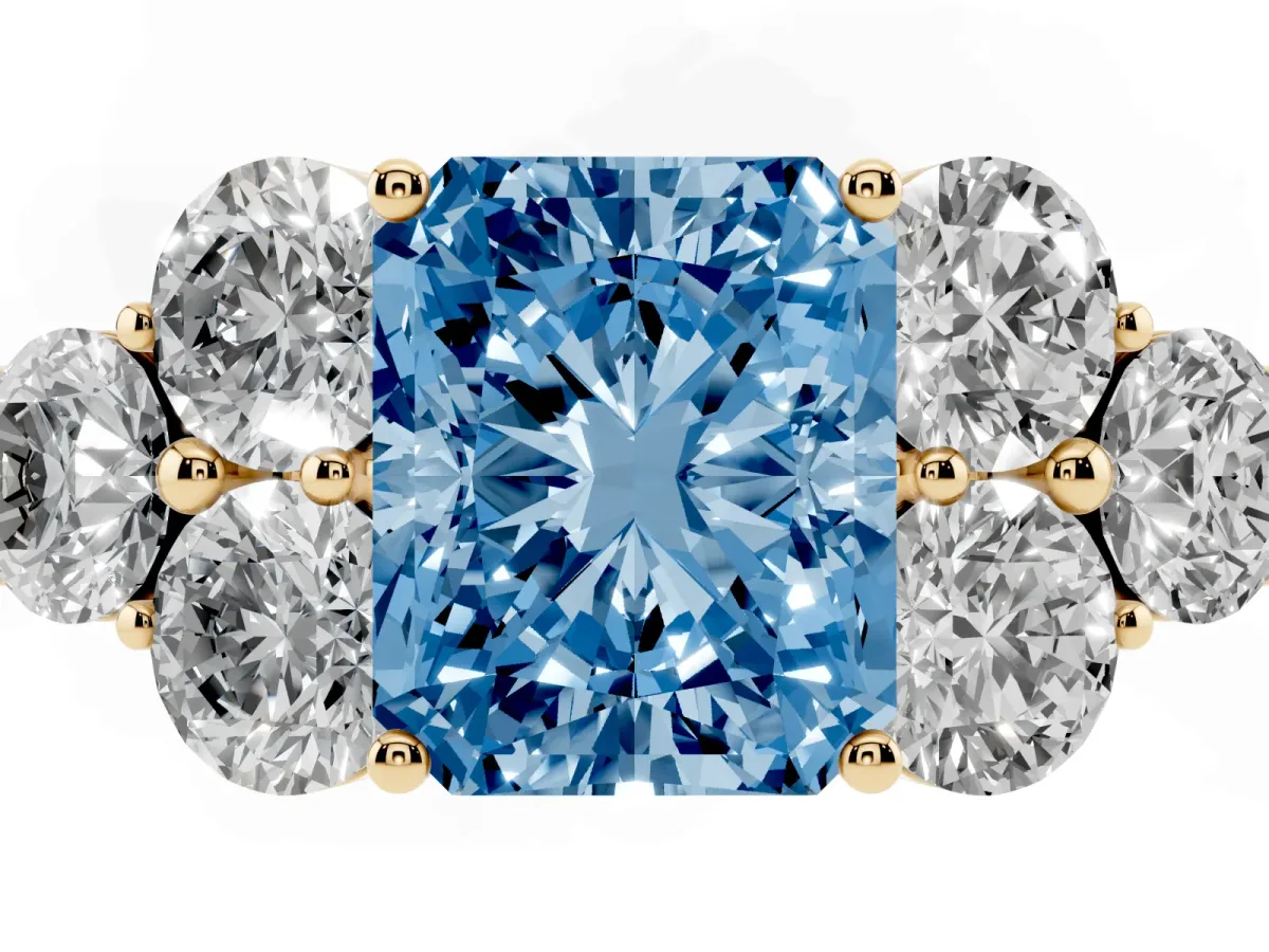 Fancy Blue Radiant Cut Cut Diamond Cluster Ring with Round Accent Stones and Prong Setting on a Classic Band Yellow gold