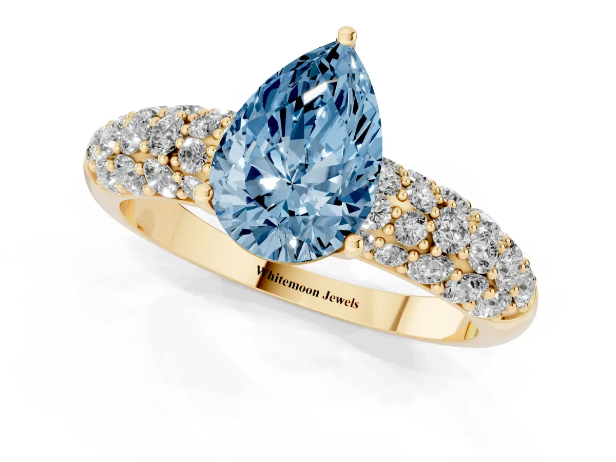 Fancy Blue Pear Cut Diamond Pavé Band Solitaire Ring with Four-Prong Setting Yellow gold