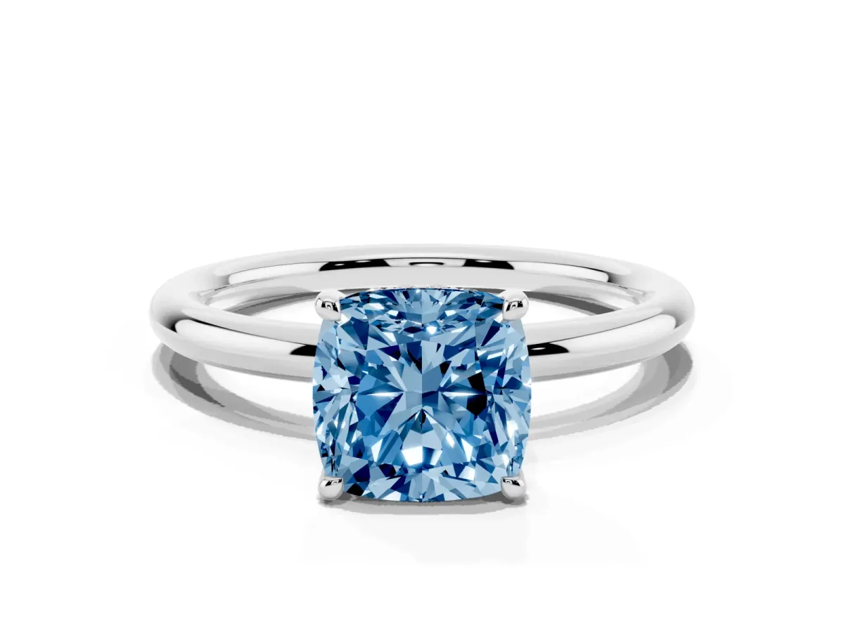 Fancy Blue Cushion Cut Diamond Solitaire Ring with Thin Band and Four-Prong Setting Platinum