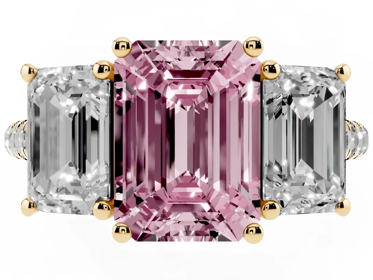 Fancy Pink Three-Stone Emerald Cut Diamond Ring with Round Pavé Band and Prong Setting Yellow gold
